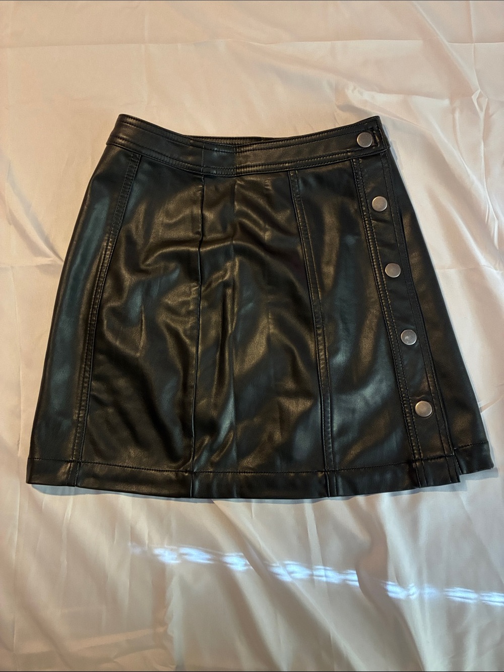 No Boundaries Black Faux Leather A-Line Mini Skirt with Snap Accents